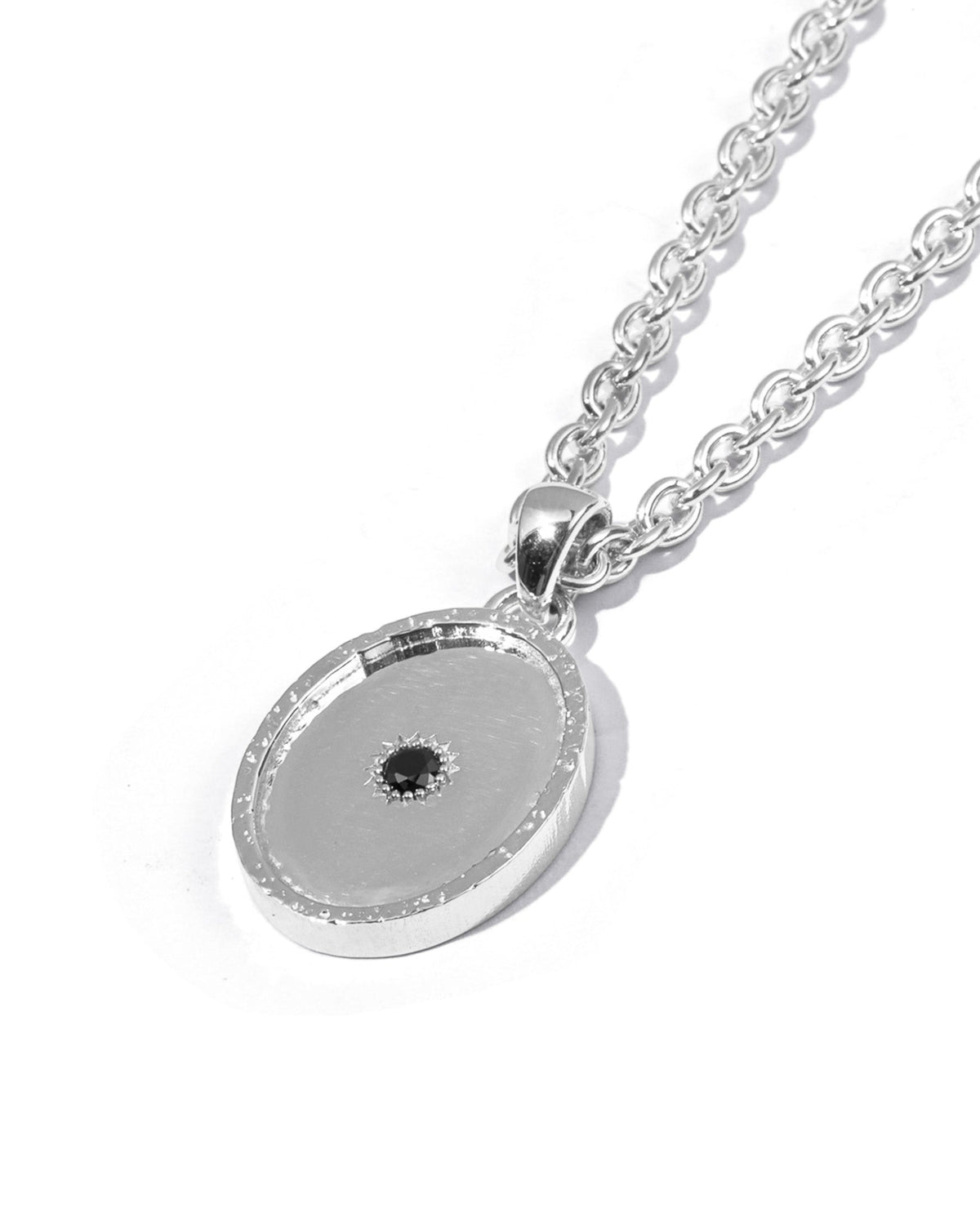 Sol Pendant handcrafted from solid 925 sterling silver featuring a central black stone.
