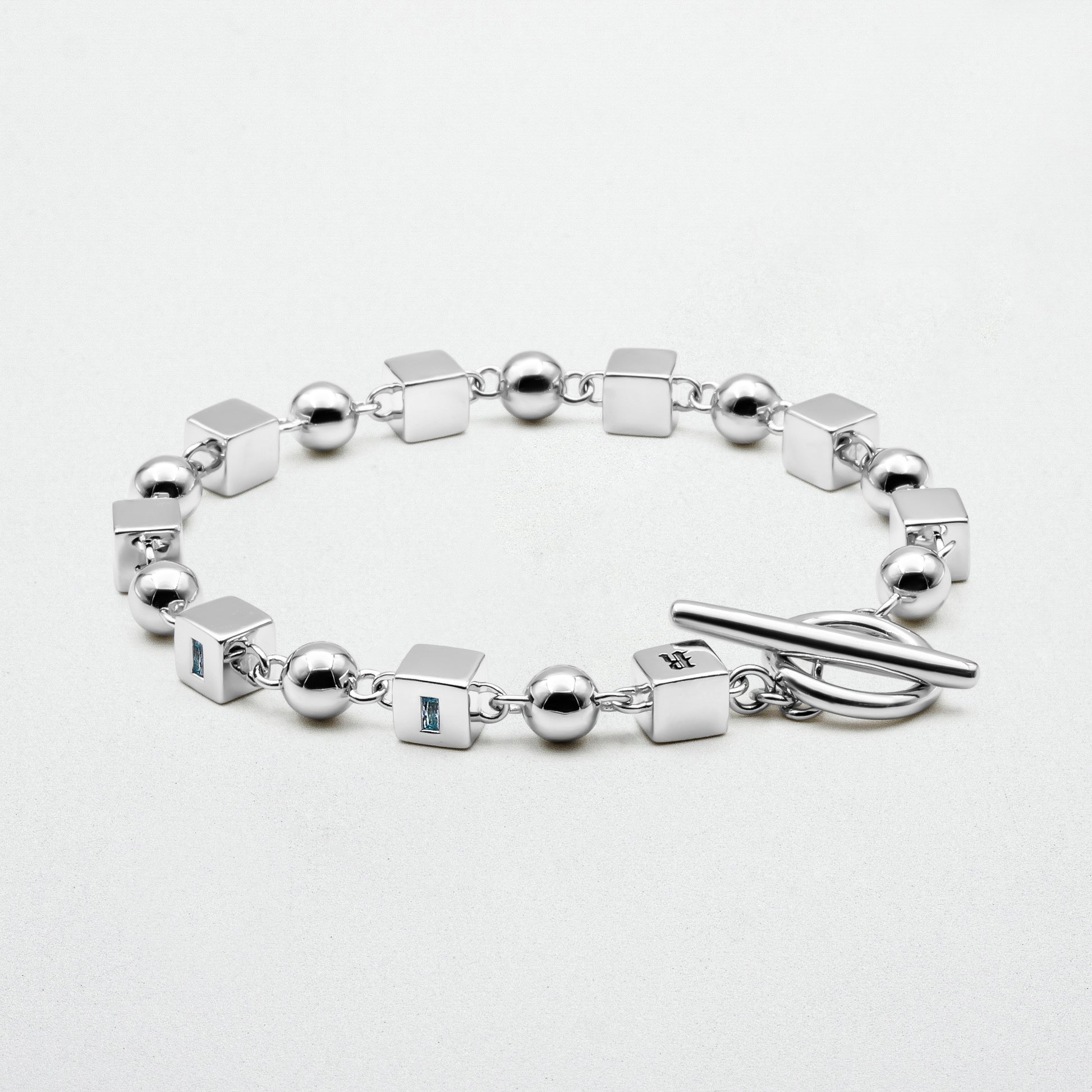 Showcasing Topaz Bracelet on white canvas