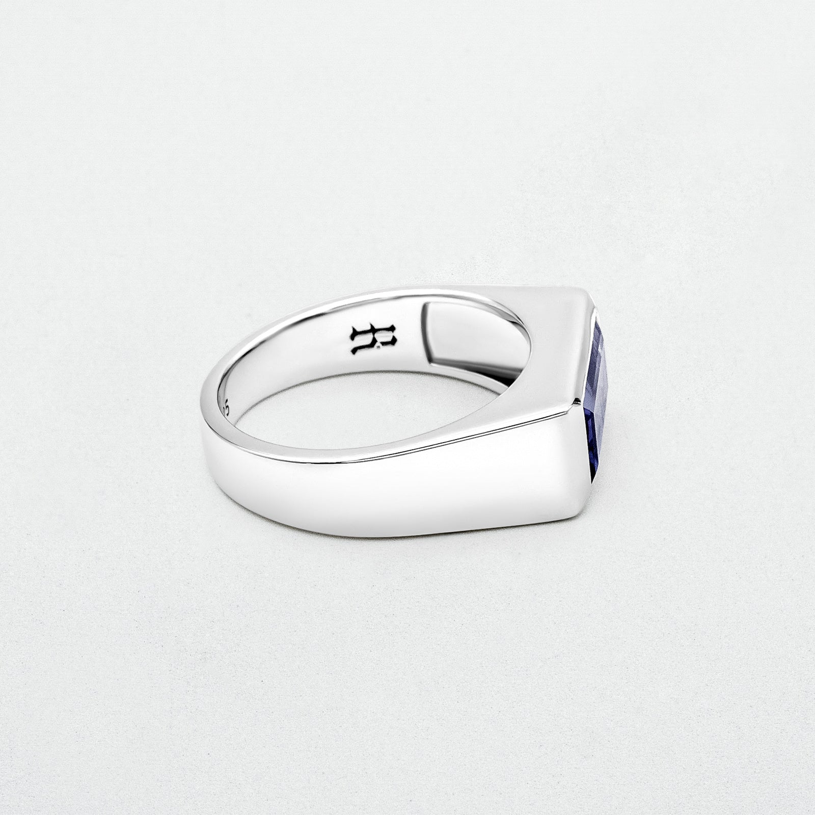 Amethyst Ring featuring a natural baguette-cut amethyst stone set in a high-polish silver rhodium-plated setting, crafted from recycled 925 sterling silver.