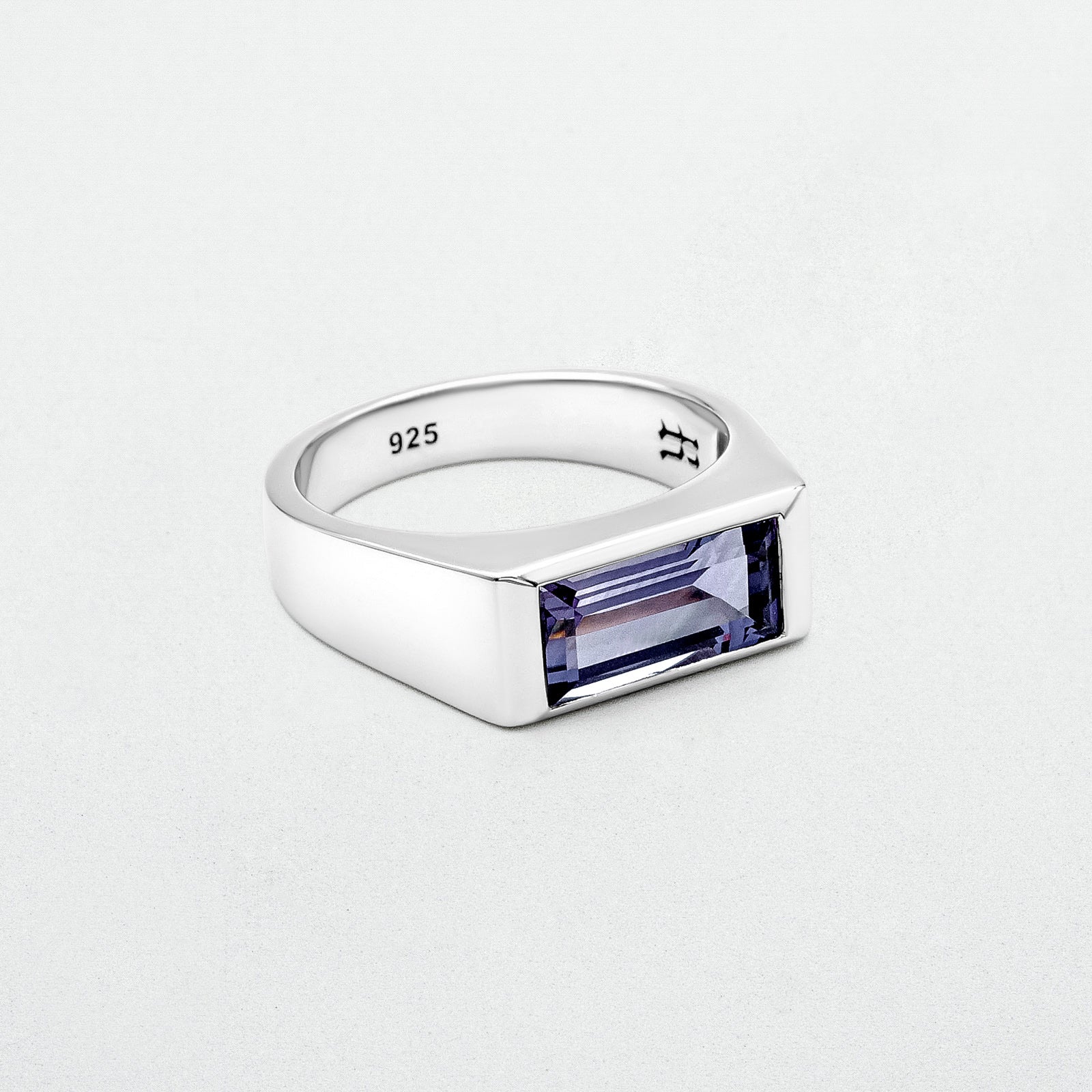 Amethyst Ring featuring a natural baguette-cut amethyst stone set in a high-polish silver rhodium-plated setting, crafted from recycled 925 sterling silver.
