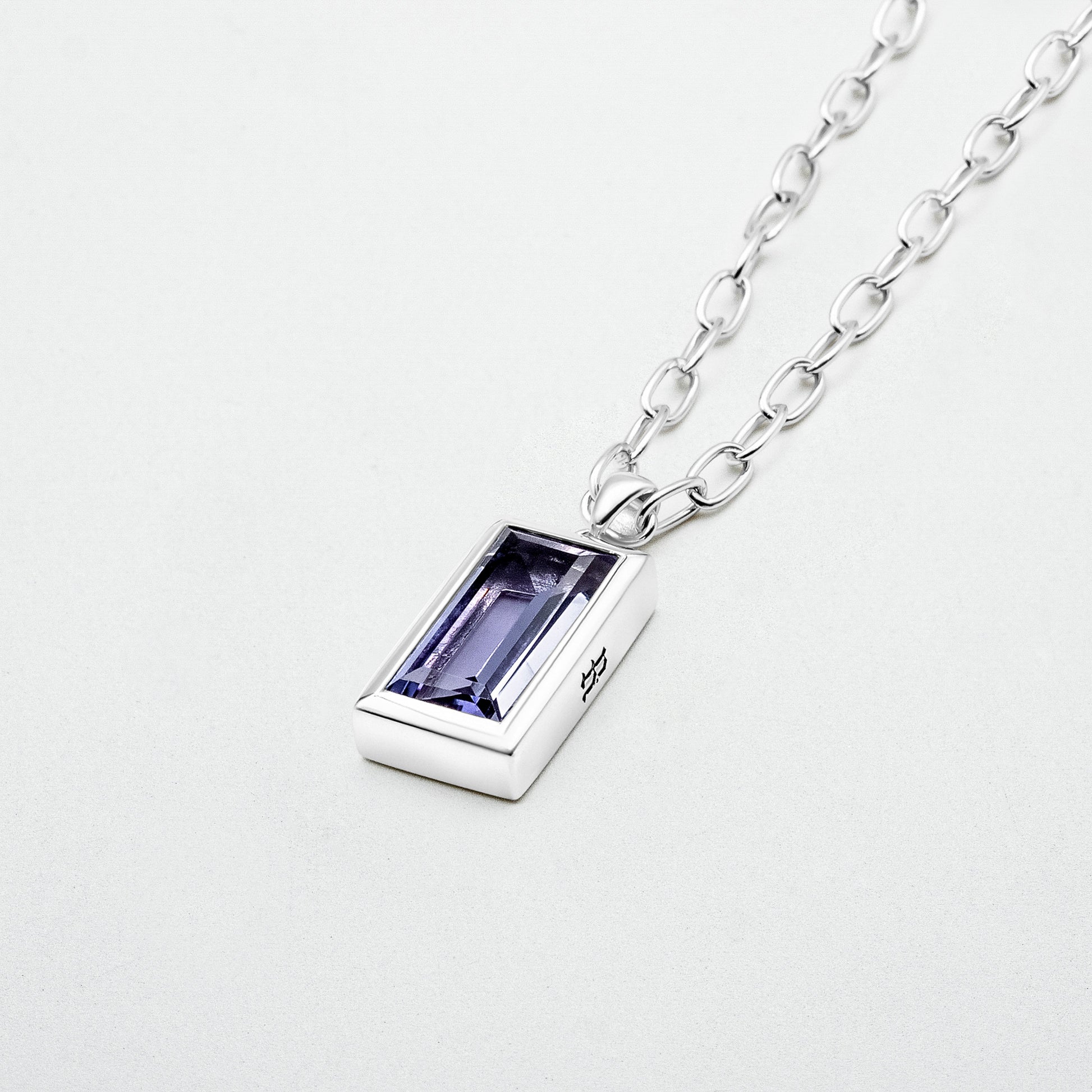 Amethyst Pendant featuring a natural baguette-cut amethyst stone set in rhodium-plated sterling silver, hanging from a 55cm sterling silver chain.