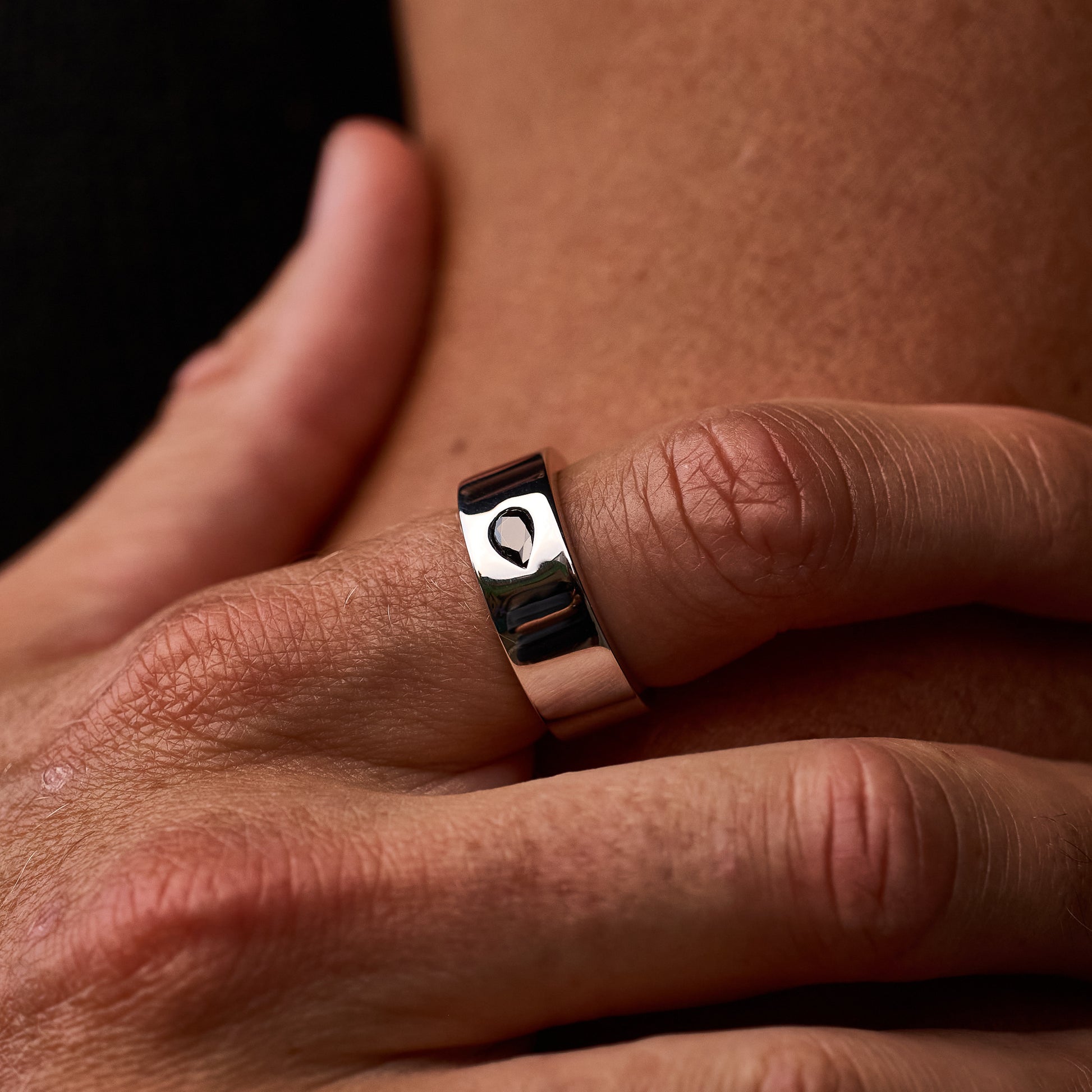 Close up shot of man wearing Teardrop Ring