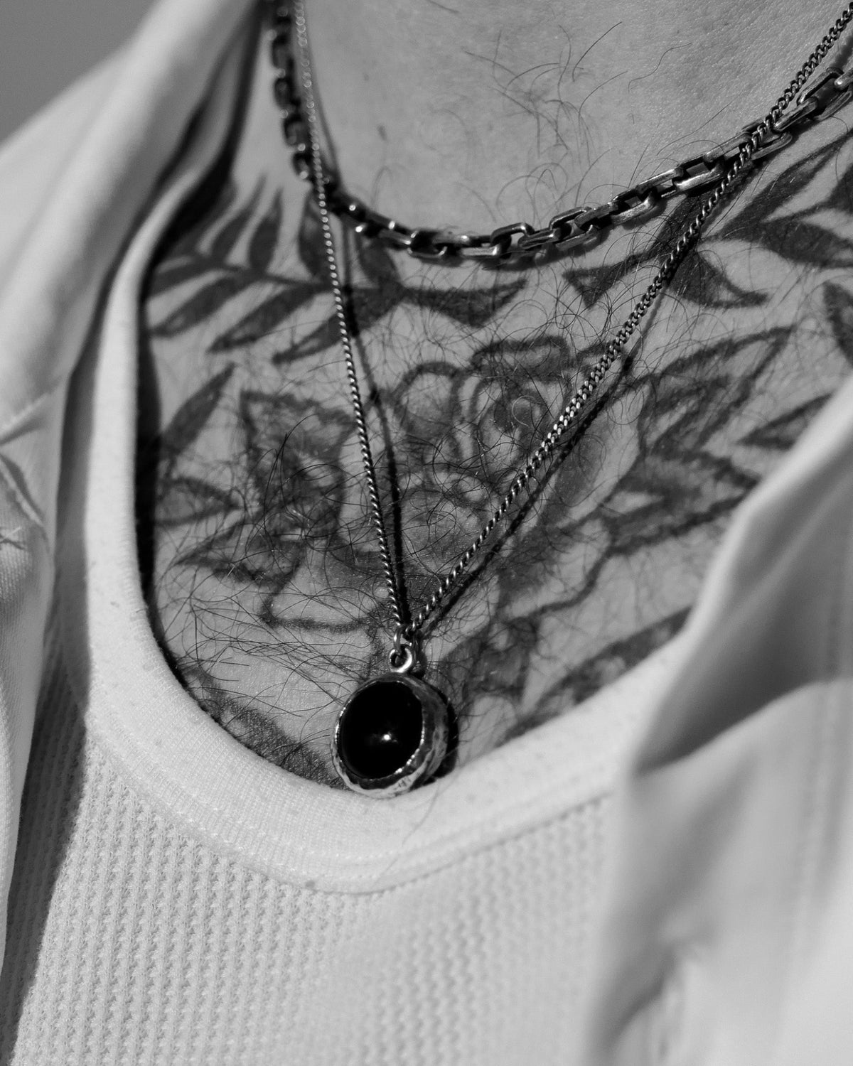 Model wearing the Black Onyx Pendant handcrafted from solid 925 sterling silver on a sterling silver necklace.