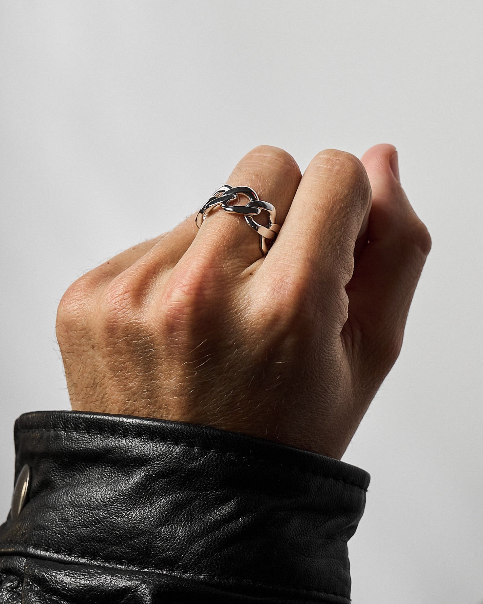 Cuban link ring worn on a model's hand