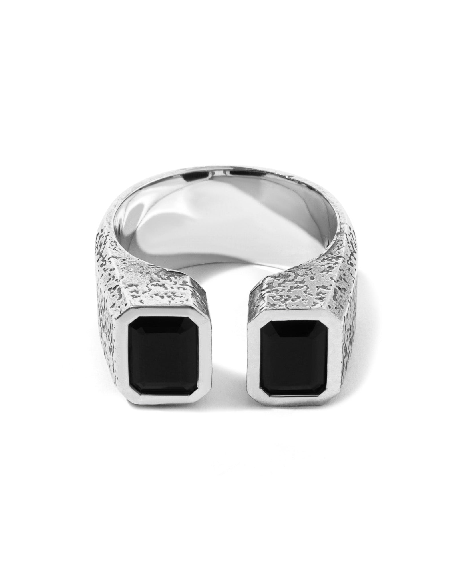 Close-up of the Felix ring's open cuff design and bezel-set