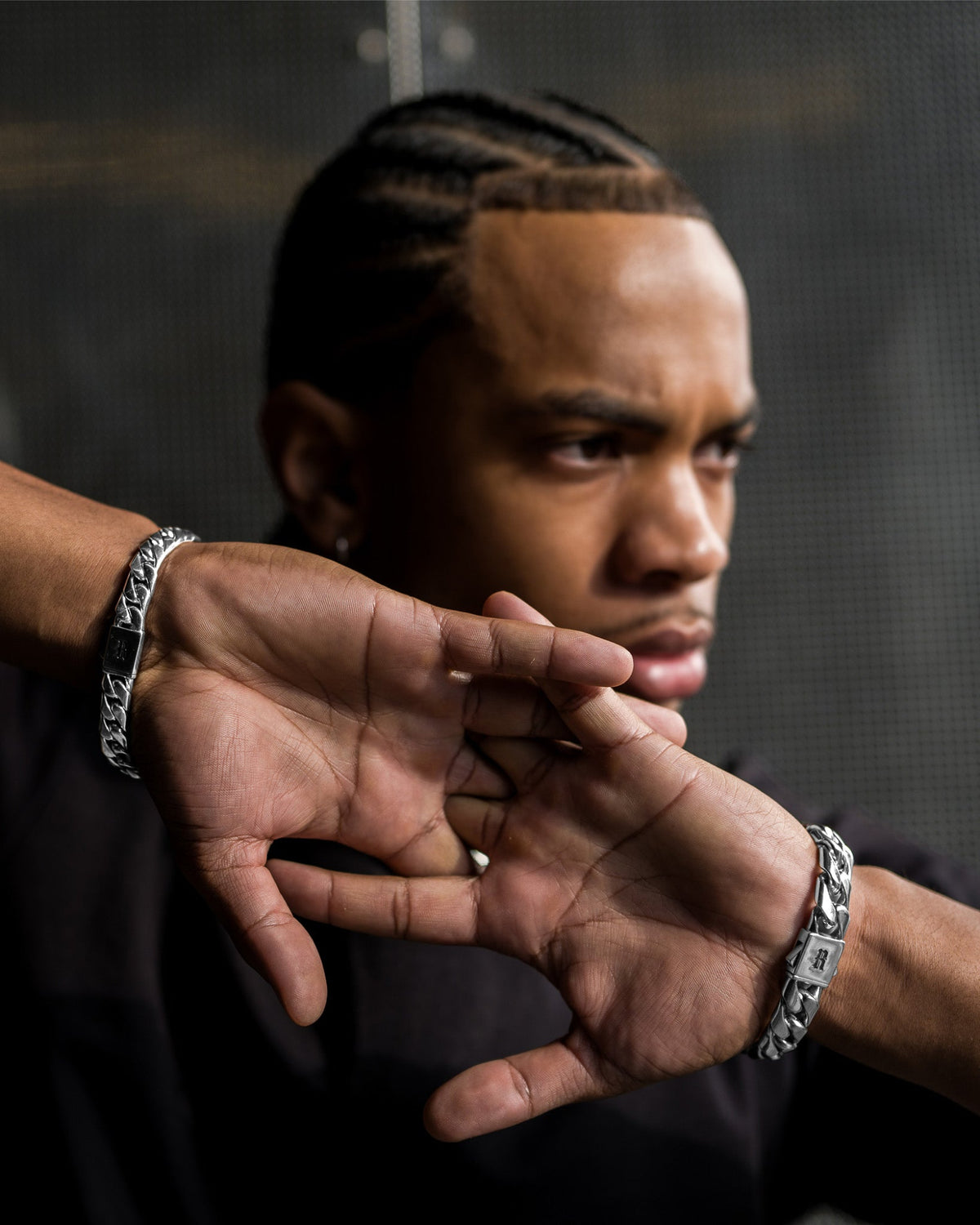 Model wearing the Large Cuban Bracelet handcrafted from solid 925 sterling silver with heavyweight Cuban links one.