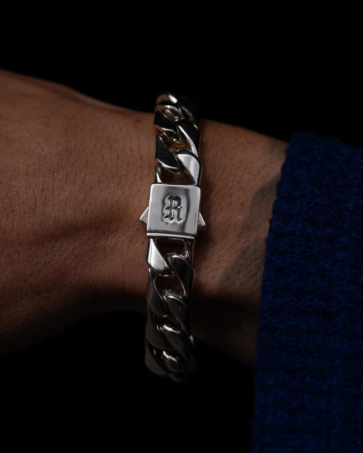 Model wearing the Large Cuban Bracelet handcrafted from solid 925 sterling silver with heavyweight Cuban links two.