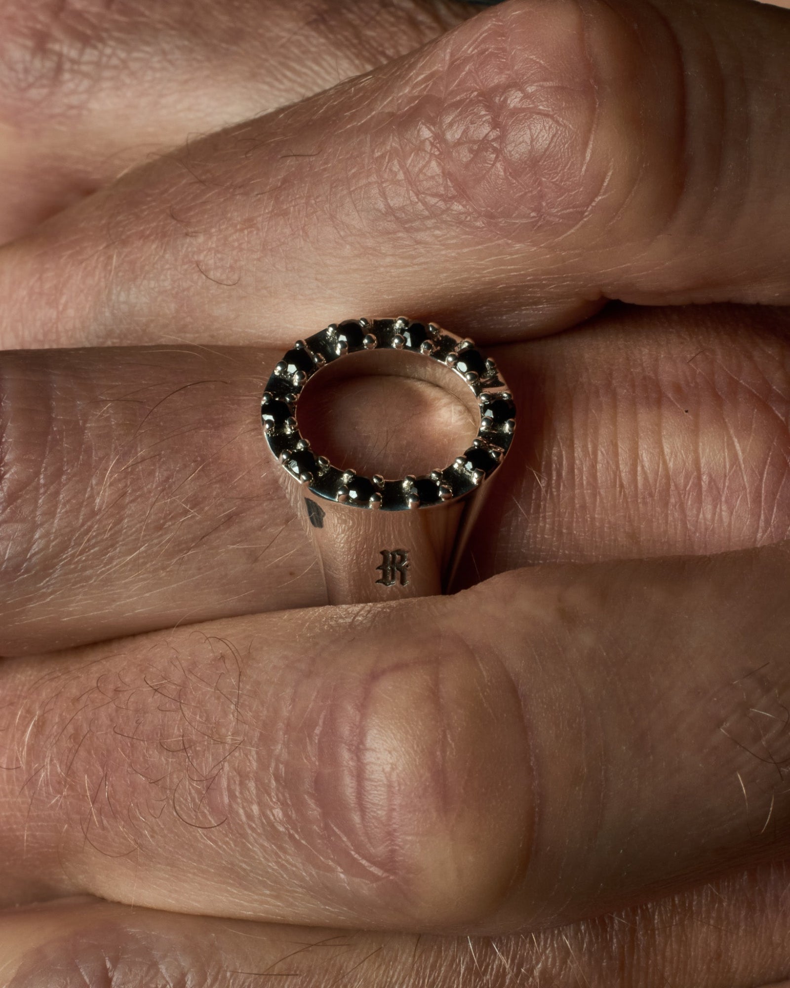 Close-up of the Octavia ring's black onyx stones