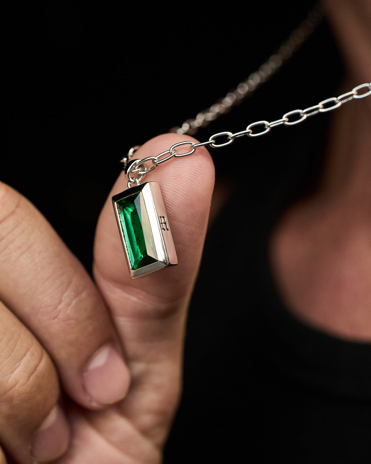 Premium sterling silver Sona Emerald Pendant featuring a green emerald-coloured stone.