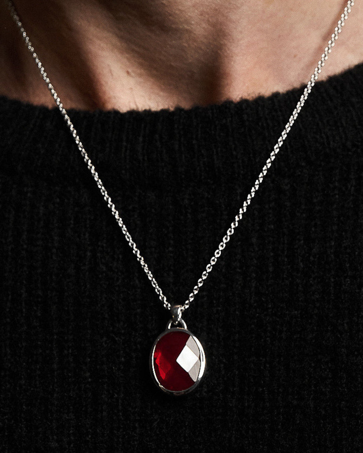 Suki Red Garnet Pendant handcrafted from solid 925 sterling silver featuring a faceted red garnet stone.