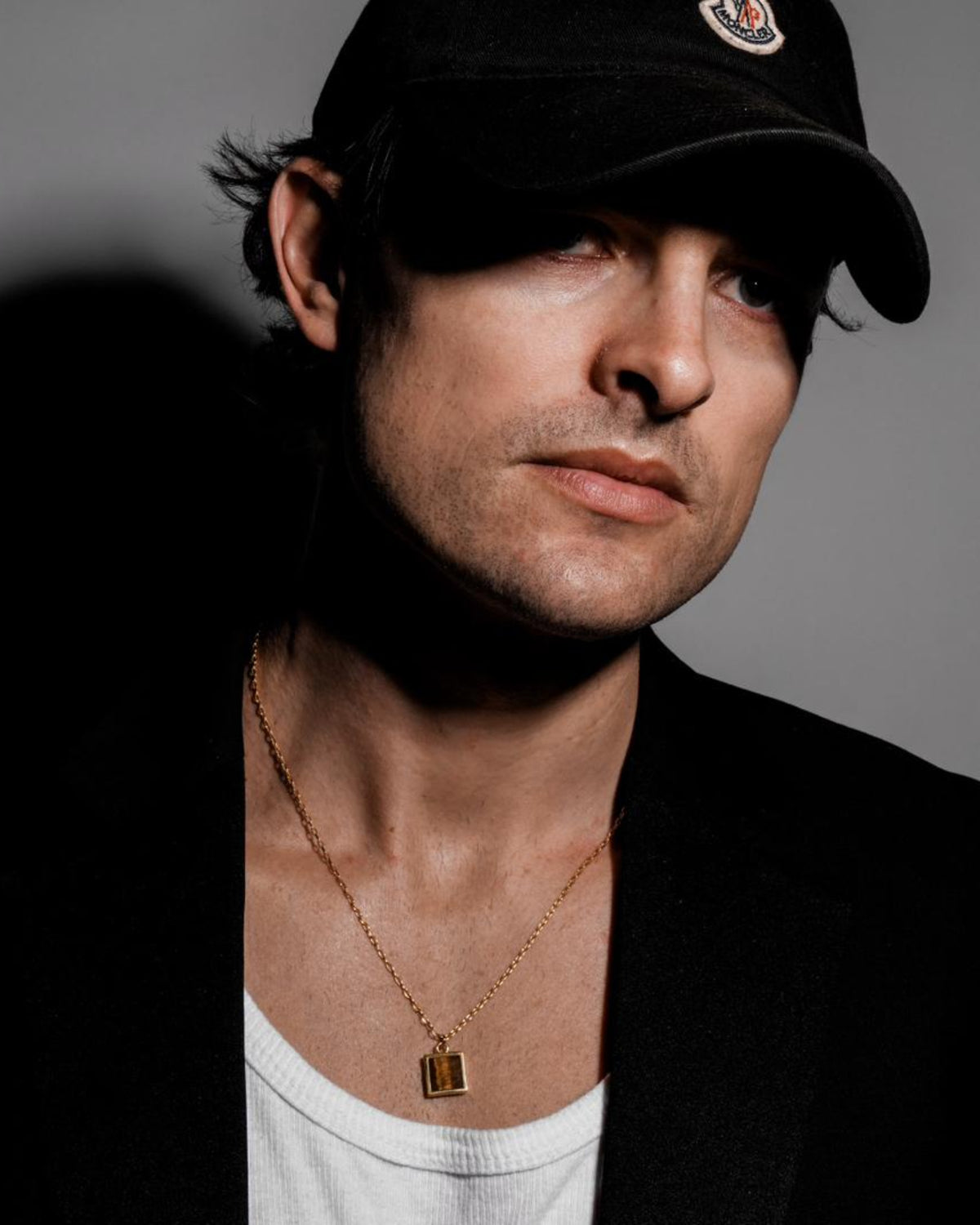 Model wearing the Tiger's Eye Pendant handcrafted from solid 925 sterling silver with a premium 3.5 micron 18K gold vermeil finish.