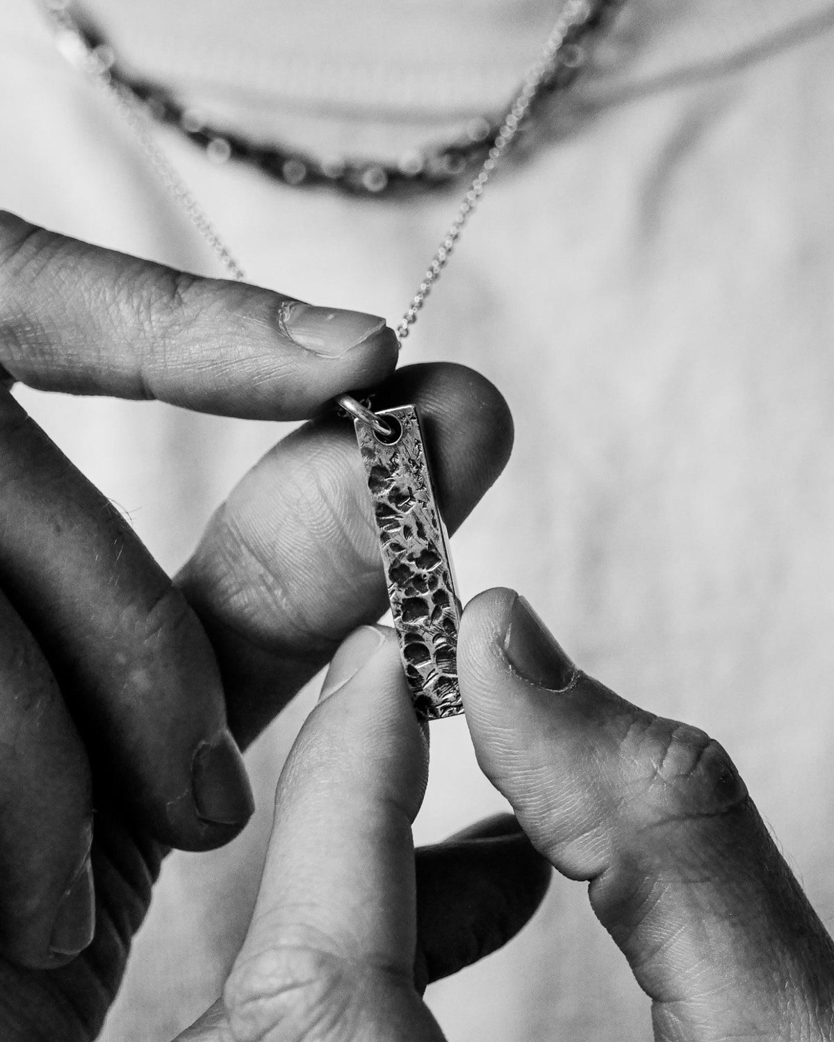 Levi Pendant handcrafted from solid 925 sterling silver featuring an organic textured dog tag design.