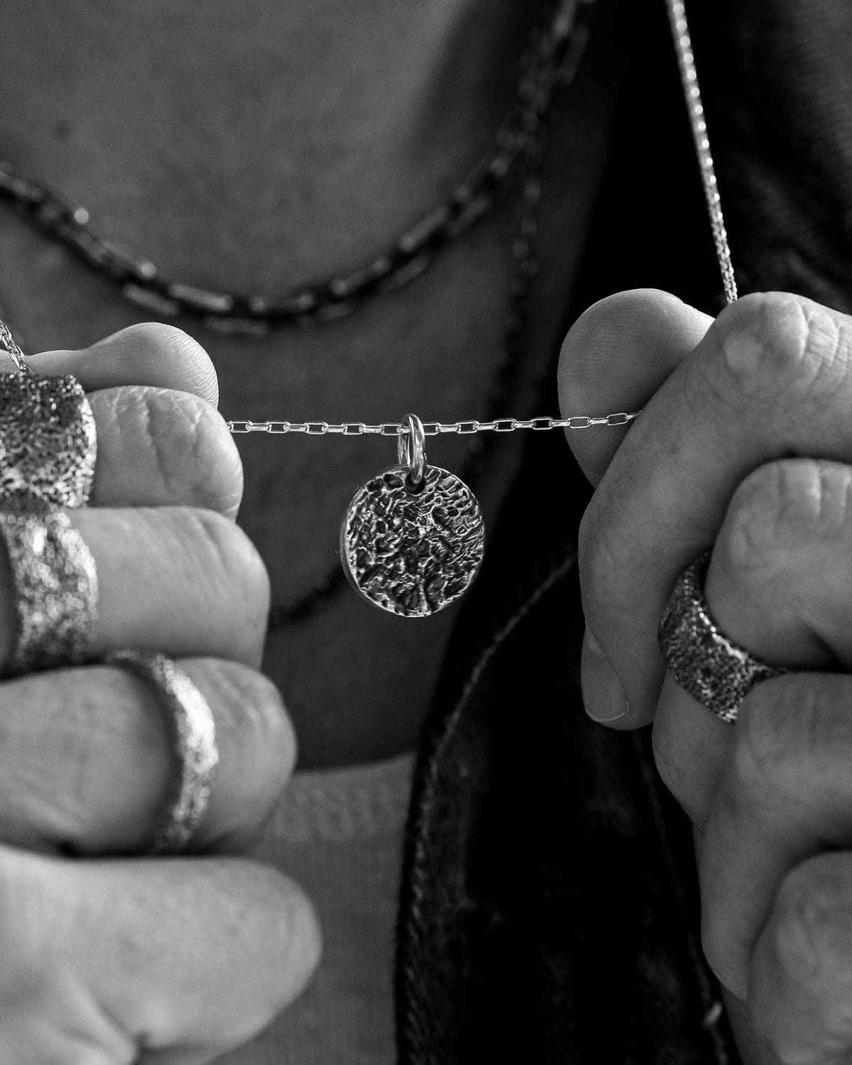 Martinez Pendant handcrafted from solid 925 sterling silver featuring an organic textured disc design.