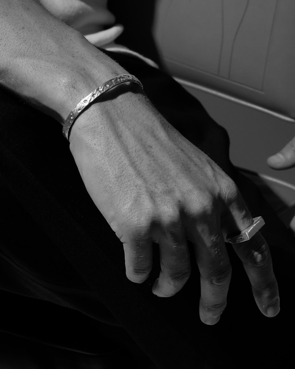 Model wearing the Mickey Cuff handcrafted from solid 925 sterling silver with a subtle organic textured finish.