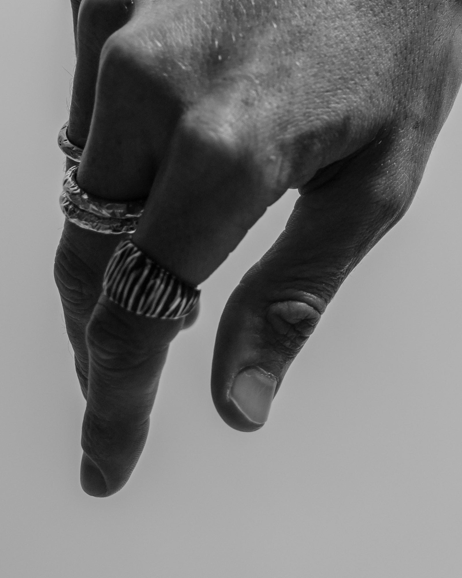Otis ring worn on a model's hand